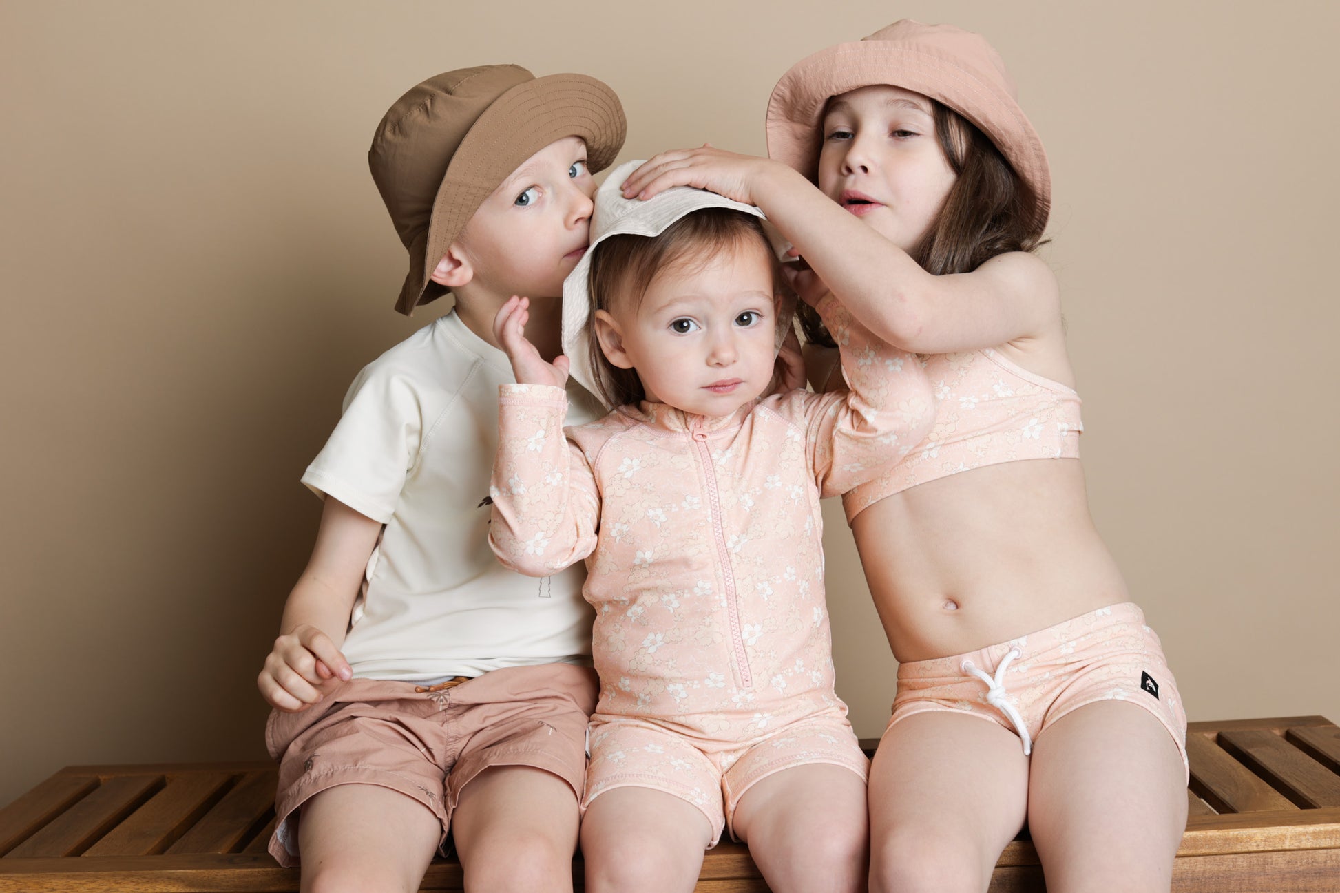Baby wearing Evangelina Tuscany jumpsuit – side view with high collar
