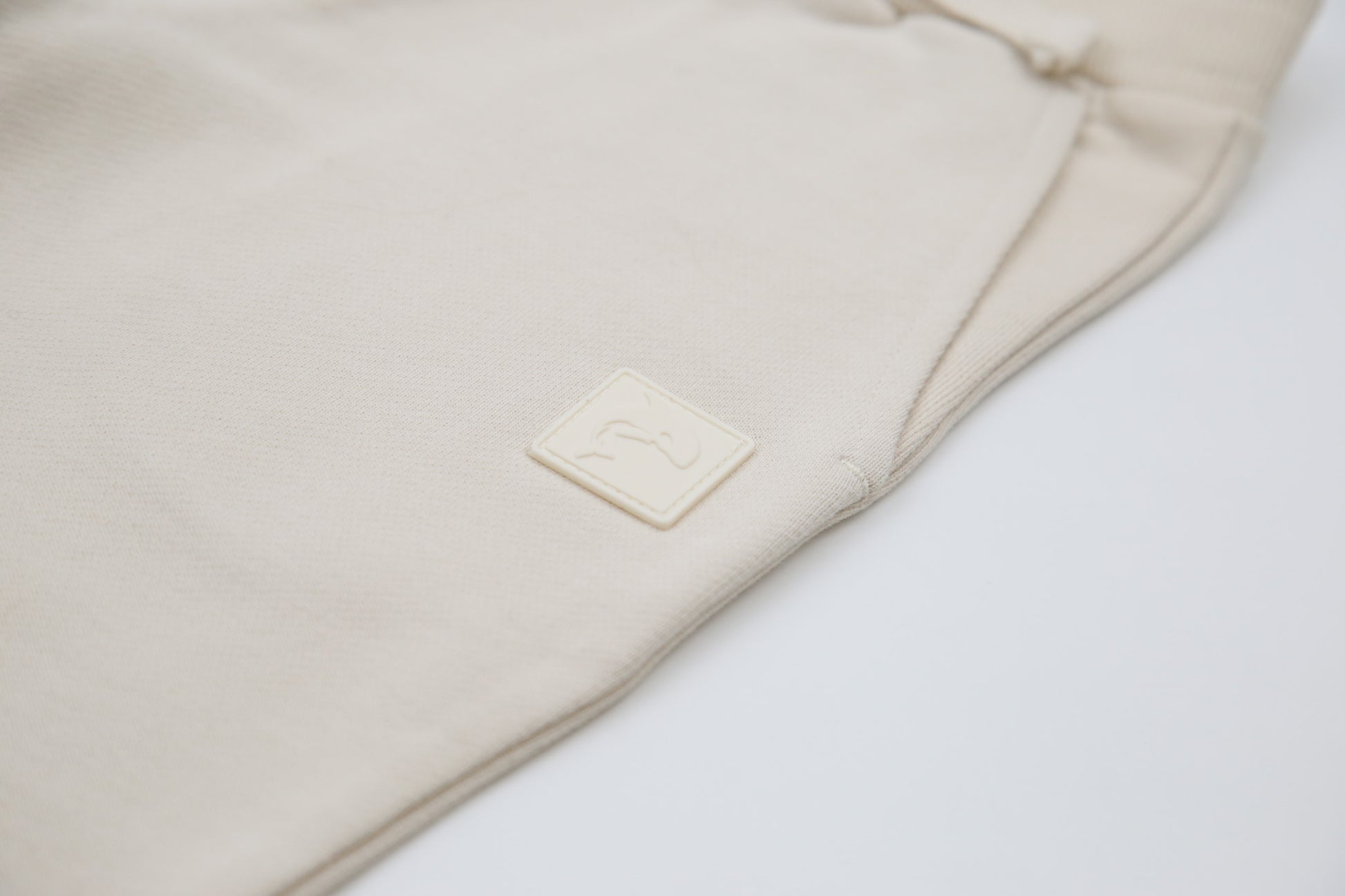 Rib cuff and elastic waistband detail on oat french terry kids sweatpants