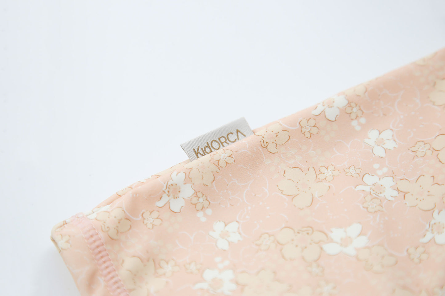 Close-up of stretchy quick-dry fabric – Evangelina Tuscany baby jumpsuit