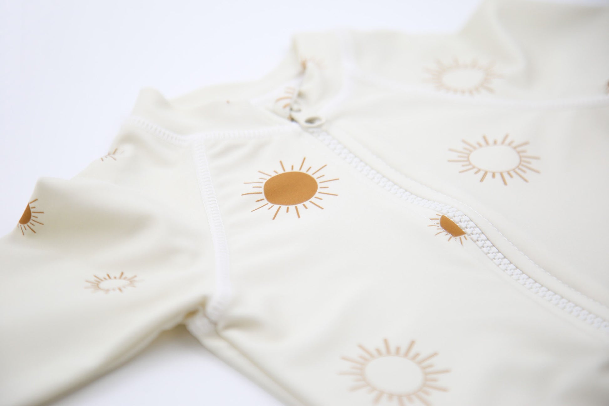 Close‑up of stretchy quick‑dry fabric – Sun Rays Shell baby jumpsuit