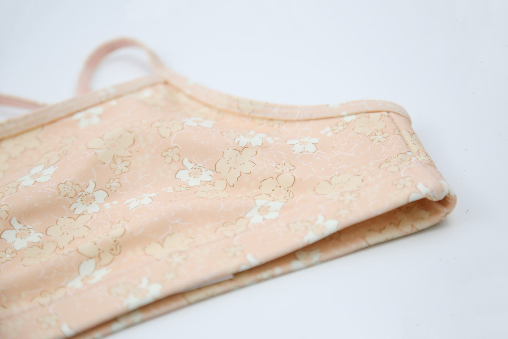 Close-up of Tuscany-print quick-dry fabric – Evangelina swim top