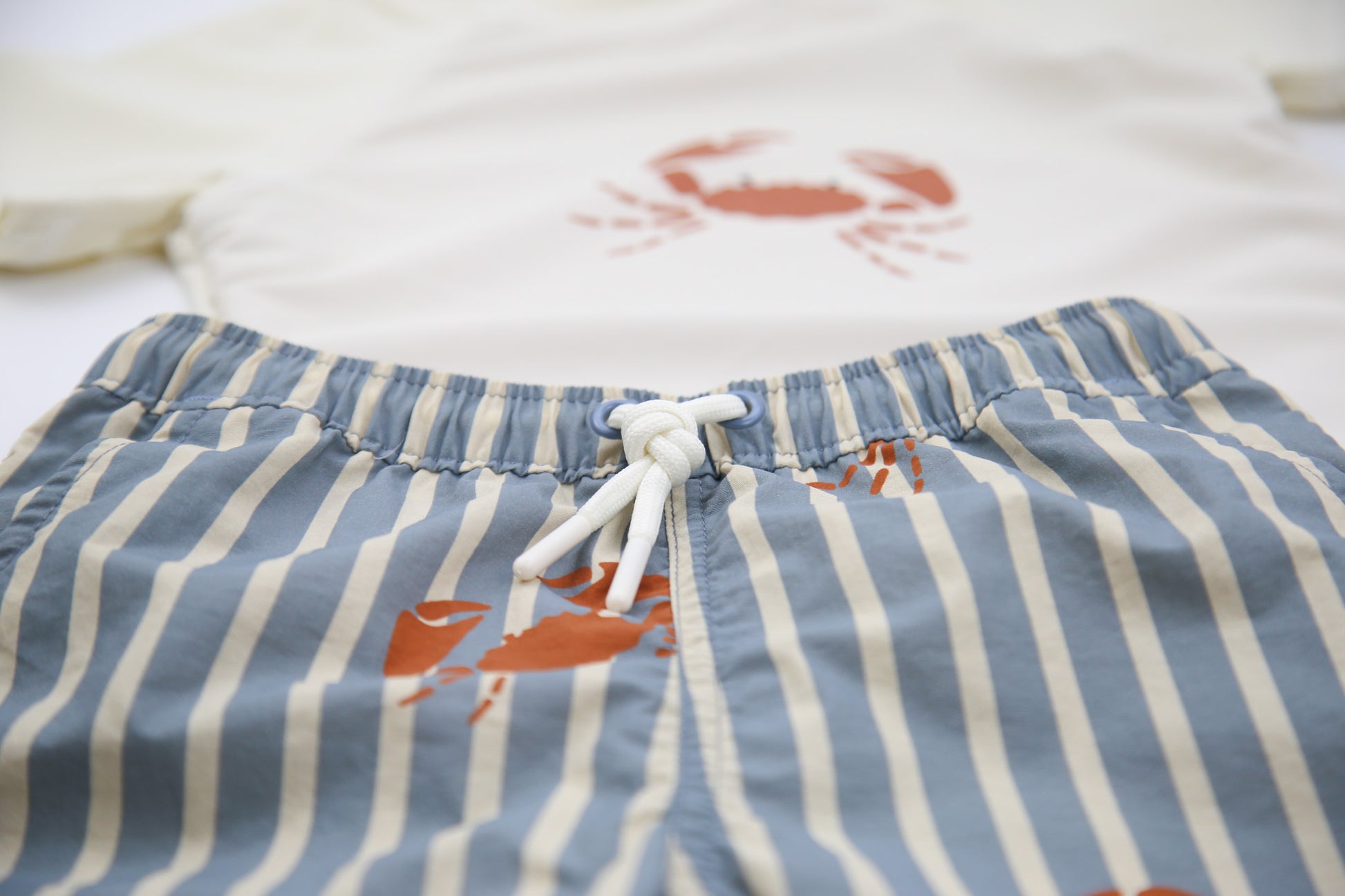 Elastic waistband detail on crab slate boys swim trunks