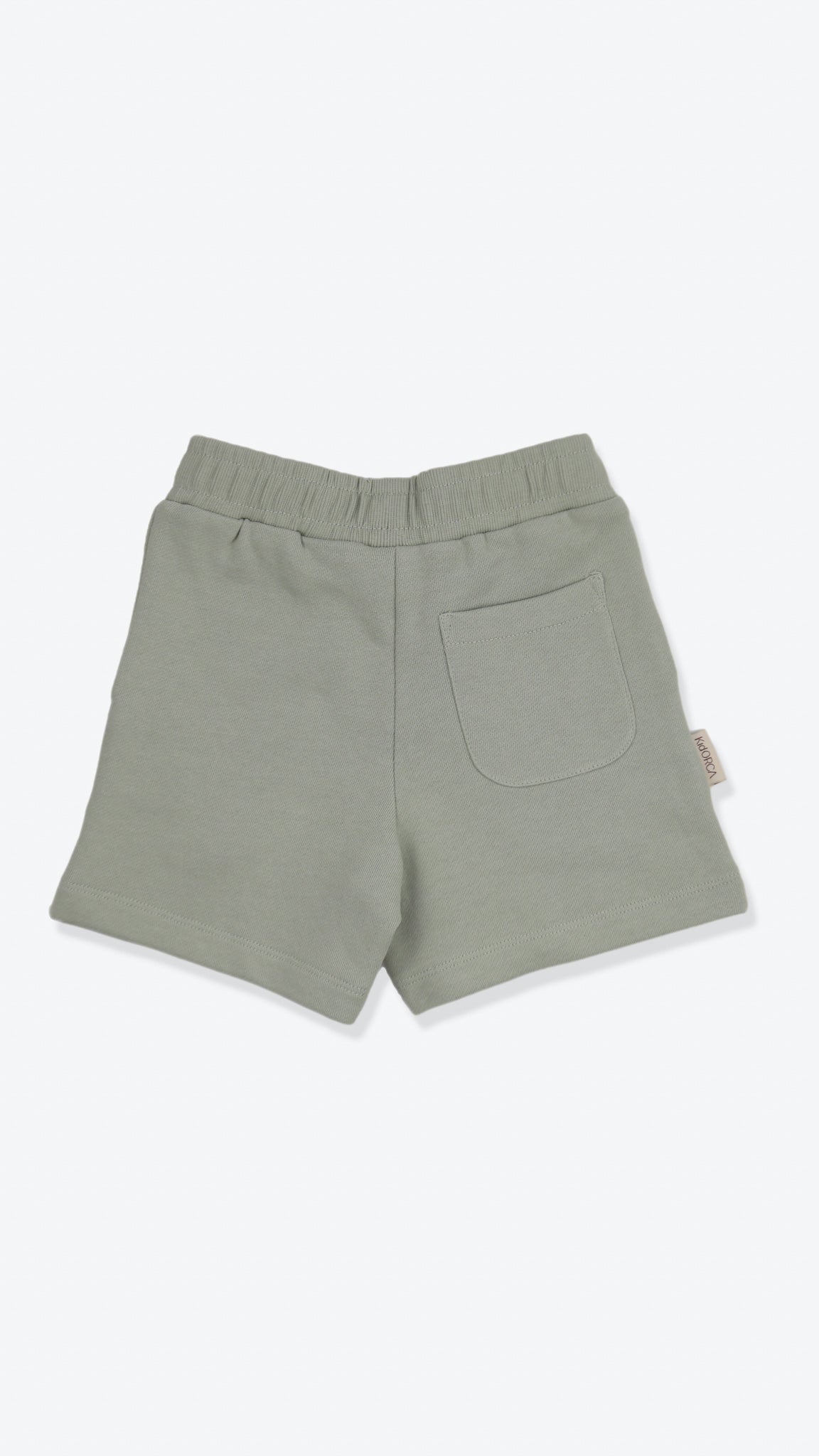 Organic french terry kids shorts in sage green – back view