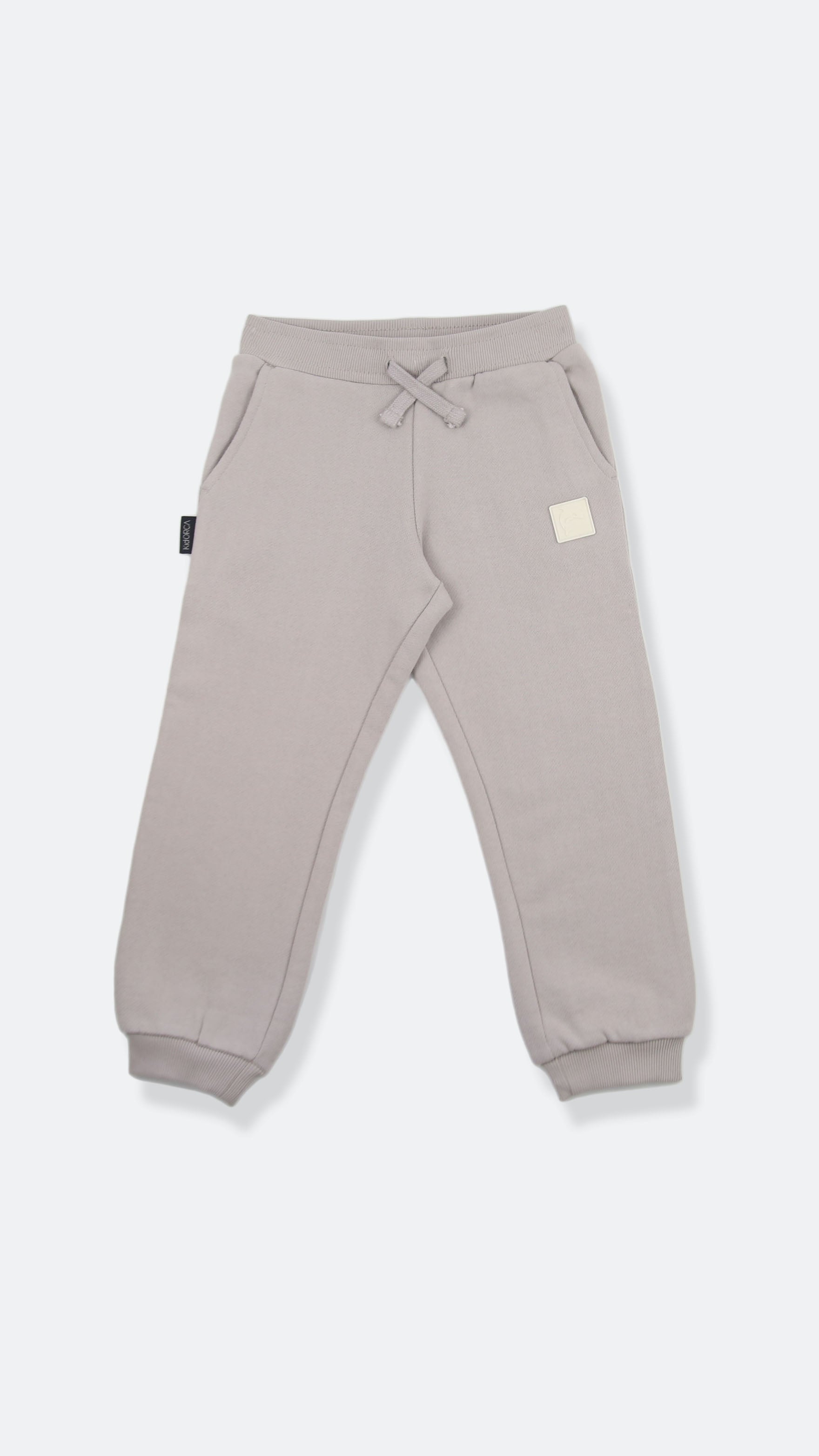 Organic brushed terry kids sweatpants in dove grey – front view