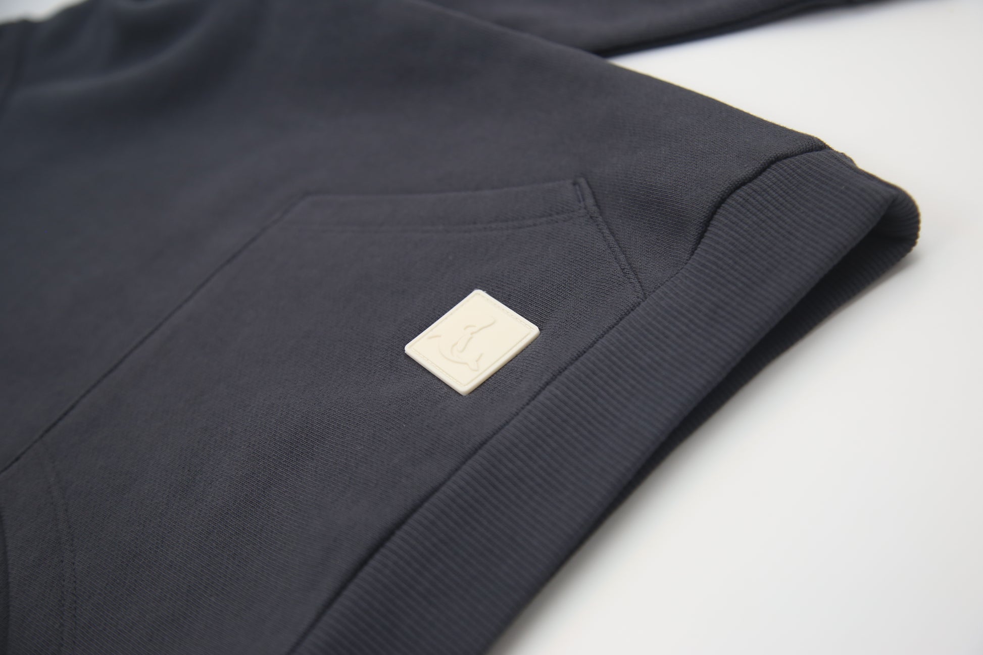 Kangaroo pocket and rib cuff detail on lava brushed terry kids hoodie