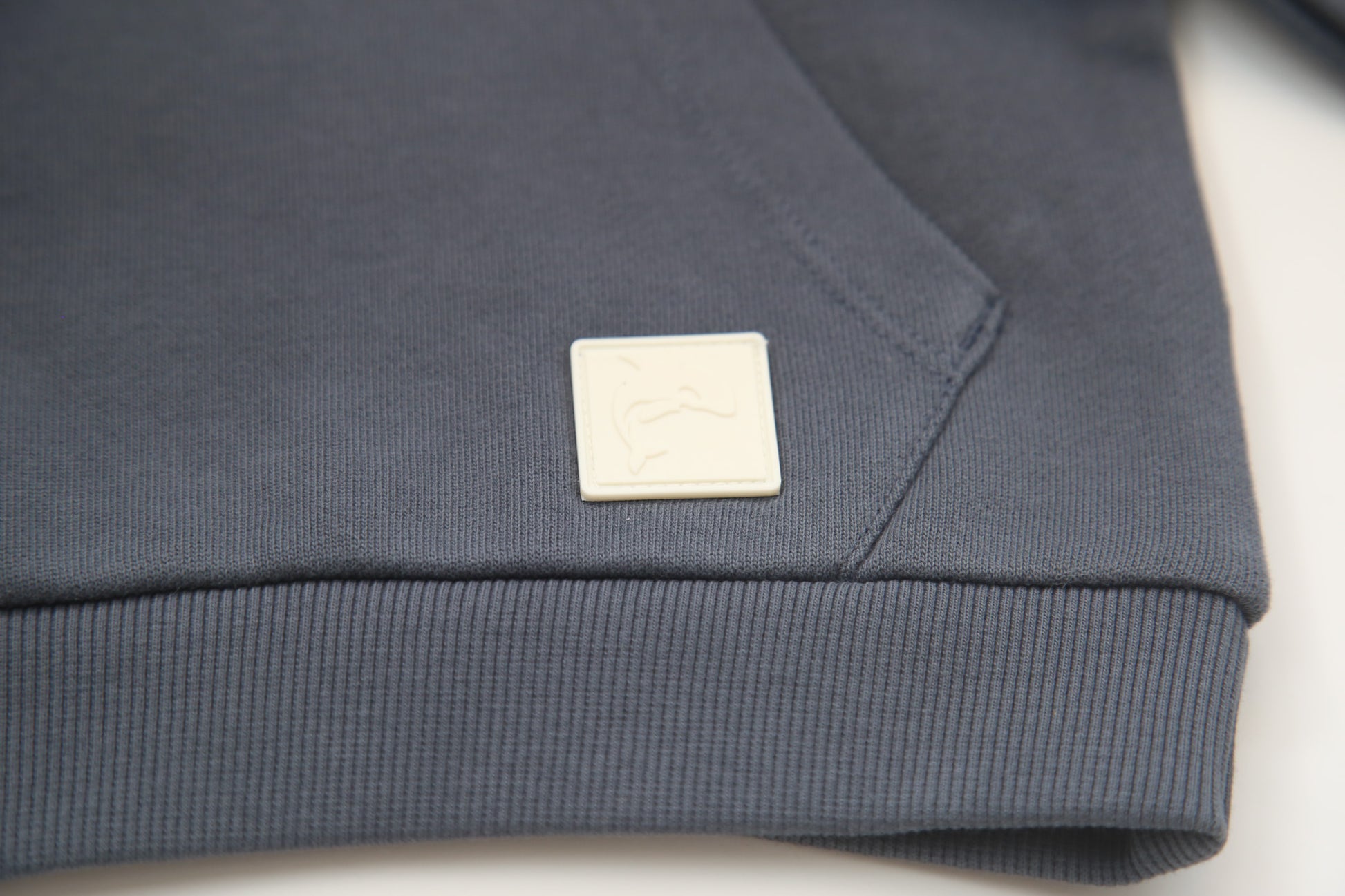 Kangaroo pocket and rib cuff detail on fjord french terry kids hoodie