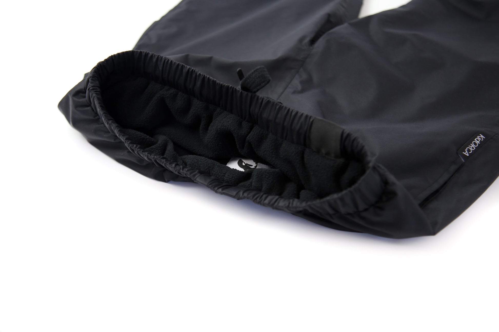 Elastic waistband detail – black insulated rain pants