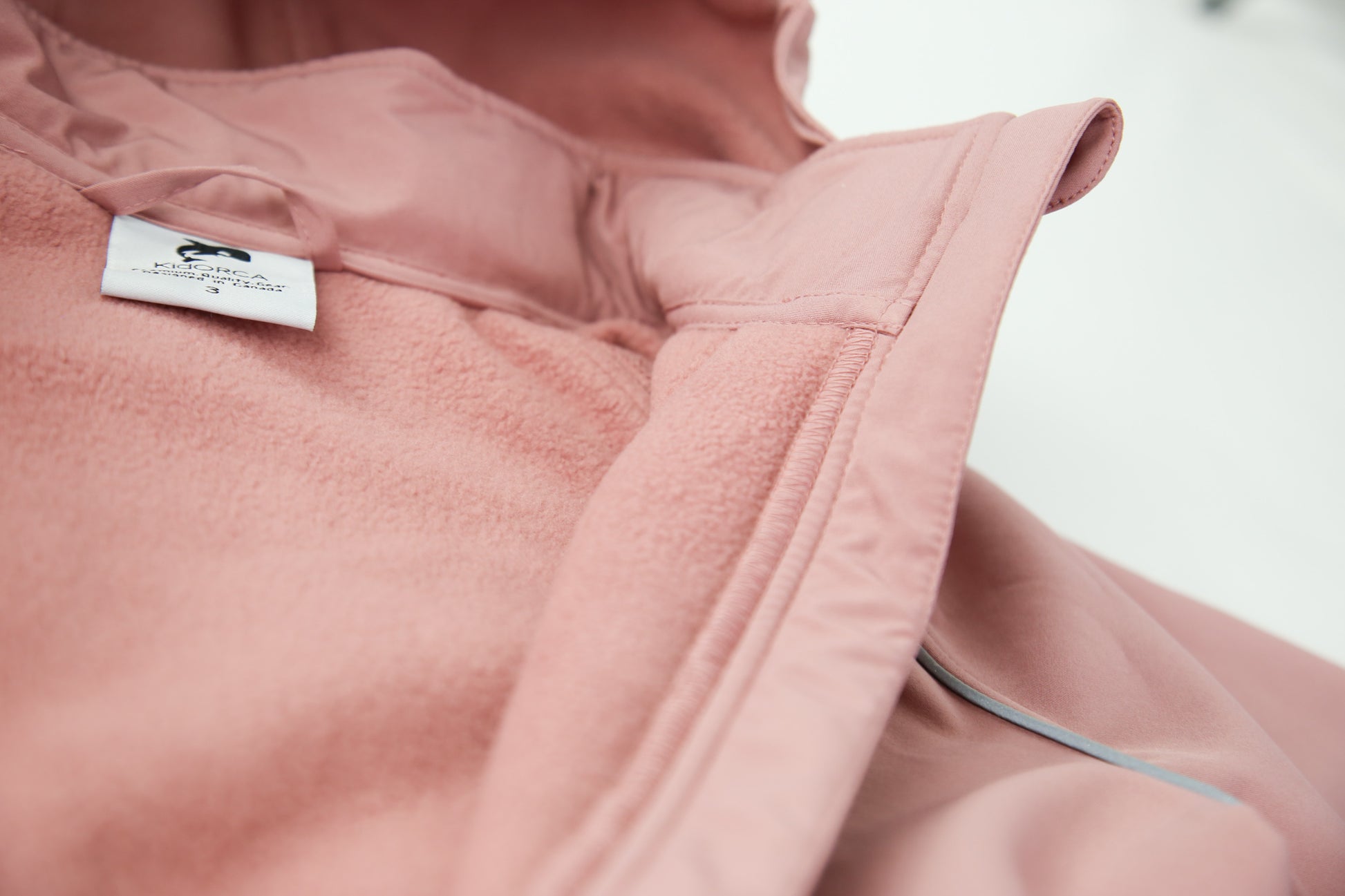 Close-up of waterproof breathable softshell fabric – ash-rose overall