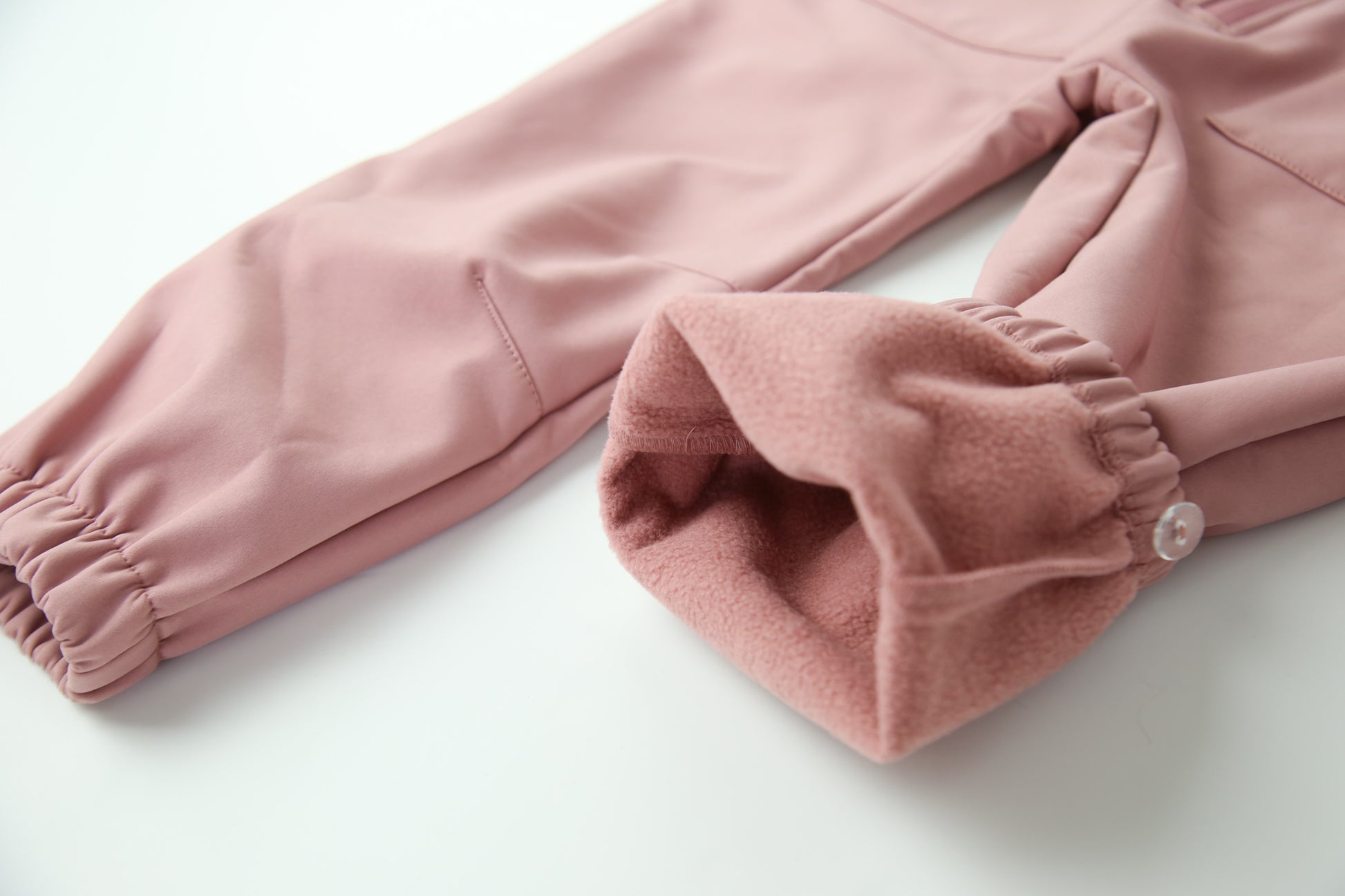 Wrist cuffs and ankle hem detail – ash-rose softshell play suit