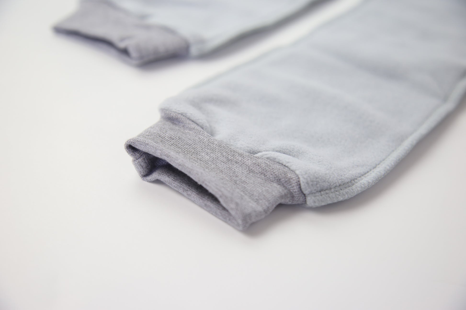 Close-up of grey fleece sock fabric texture – plush and warm
