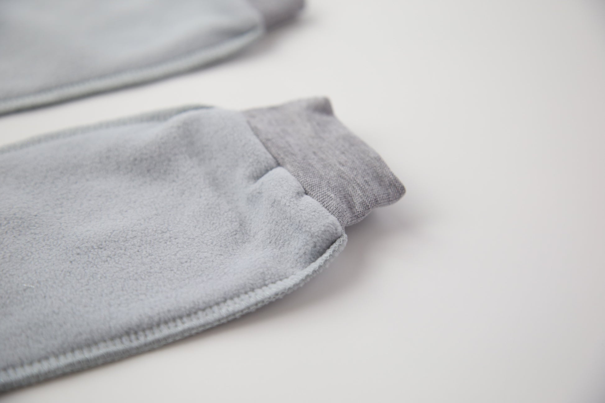 Close-up of grey fleece sock fabric texture – plush and warm