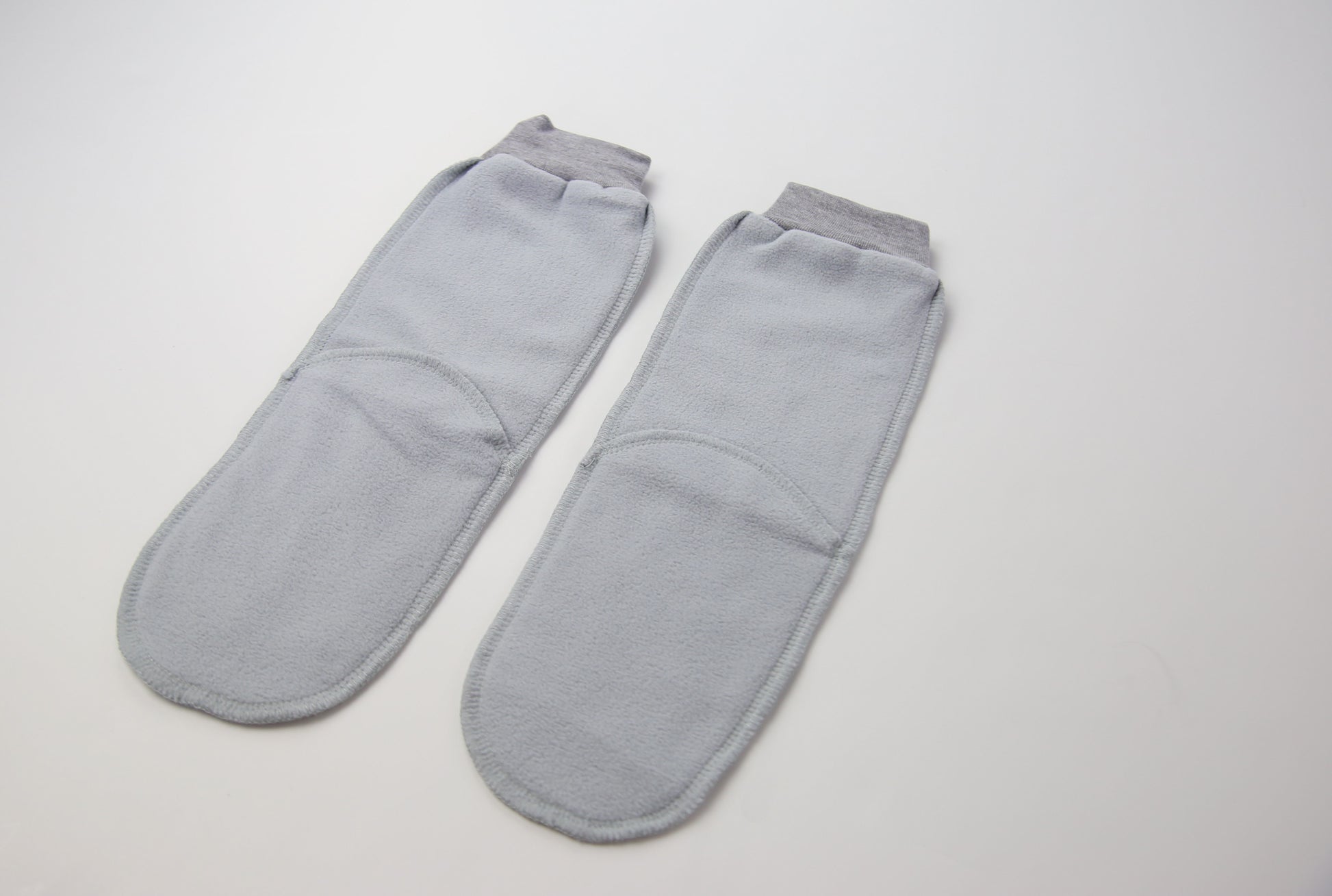 Close-up of grey fleece sock fabric texture – plush and warm