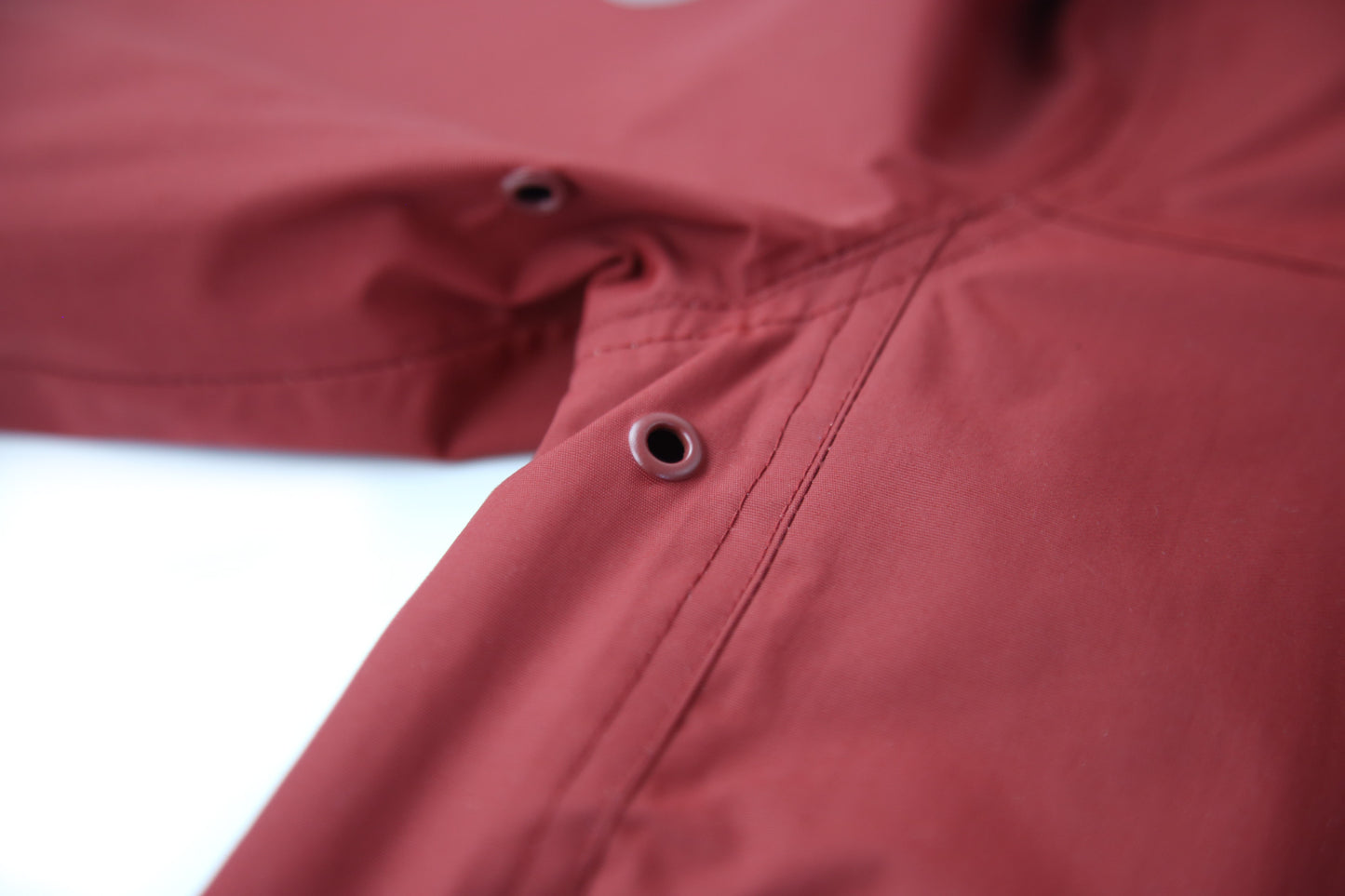 Elastic cuffs and soft lining – merlot rain jacket