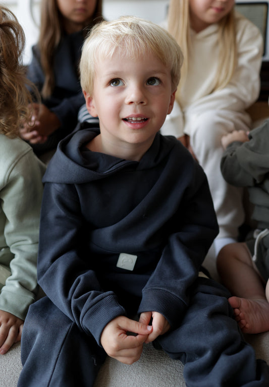 Child wearing lava brushed terry sweatpants – side view with elastic waist