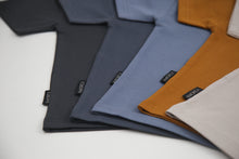 Close-up of organic cotton fabric on lava kids tee