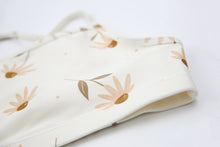 Close-up of coconut print quick-dry fabric – Viola swim top