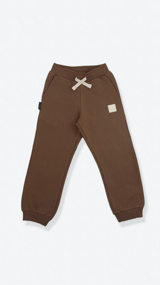 Organic brushed terry kids sweatpants in mocha color – front view