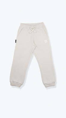 Organic french terry kids sweatpants in oat color – front view