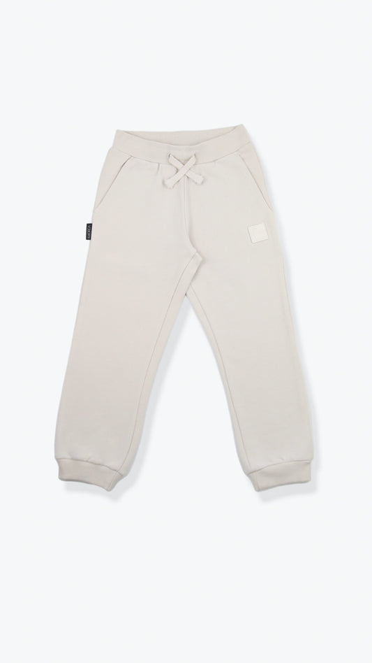 Organic french terry kids sweatpants in oat color – front view