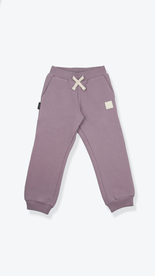 Organic brushed terry kids sweatpants in wheat color – front view
