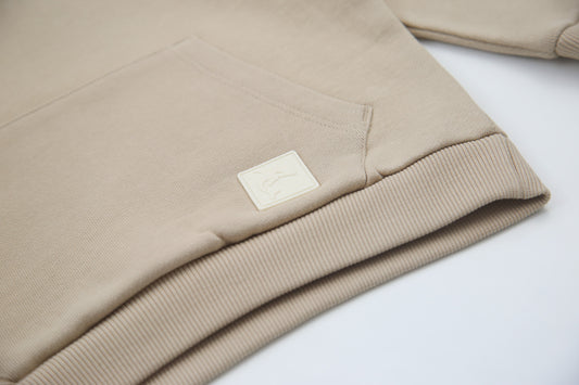 Close-up of brushed terry fabric and hood detail – wheat kids hoodie