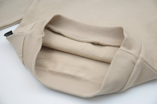 Close-up of brushed terry fabric and elastic waistband – wheat kids sweatpants