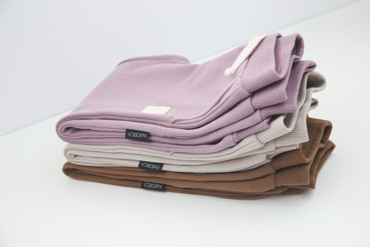 Rib cuff and side pocket detail on wheat brushed terry kids sweatpants