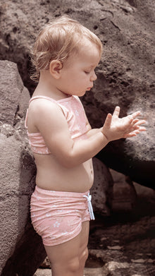 Girl playing in Evangelina Tuscany swim top by KidORCA
